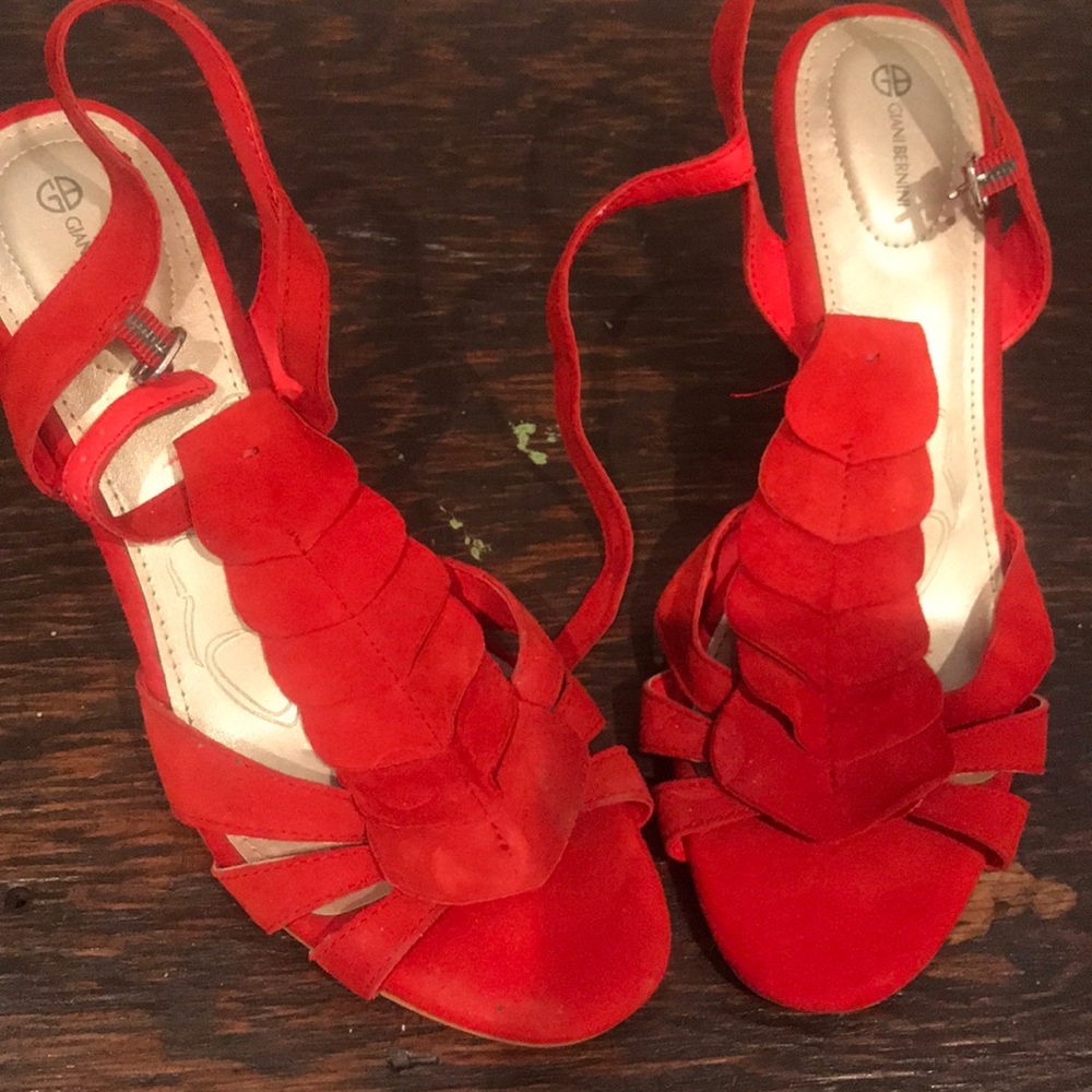 Red suede wedge heels.